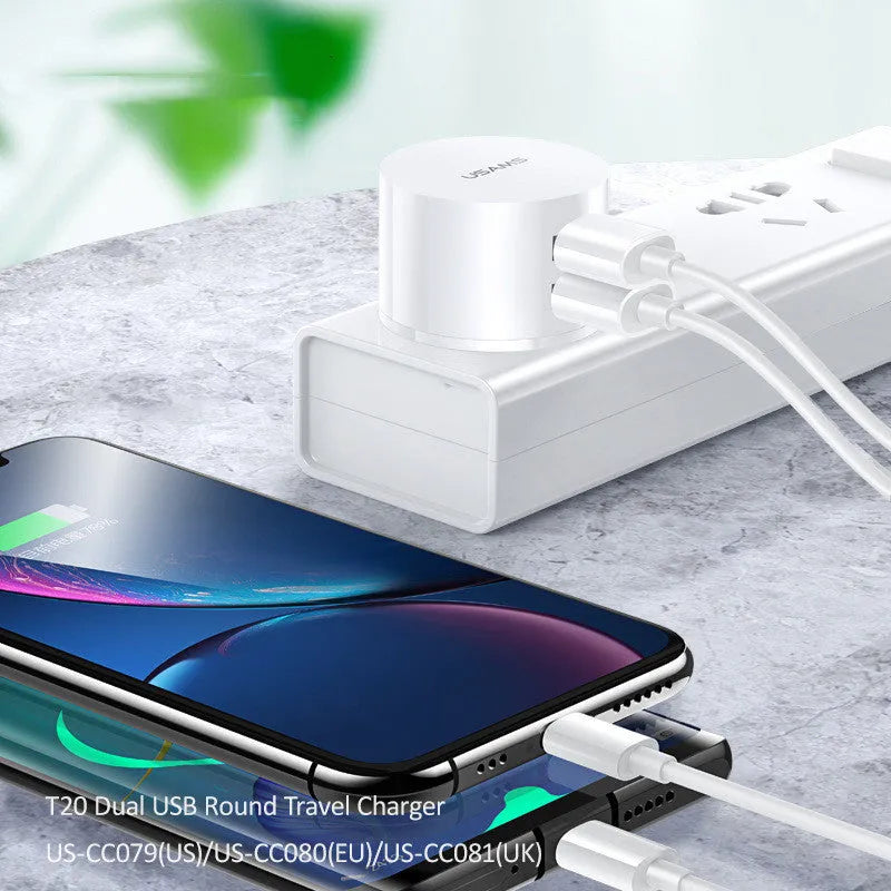 White portable USB phone charger with built-in US EU UK adapter plugs showing compact dimensions