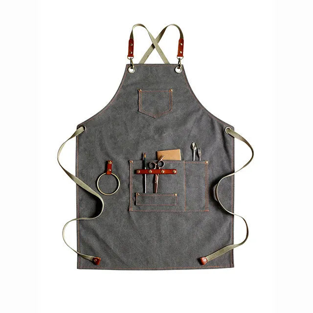 Canvas work apron with cross-back straps in camel colour for cafe and baking use