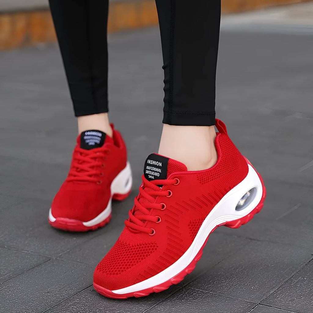 Women's black mesh sneakers with round toe and lace-up design, flat heel and low-top construction
