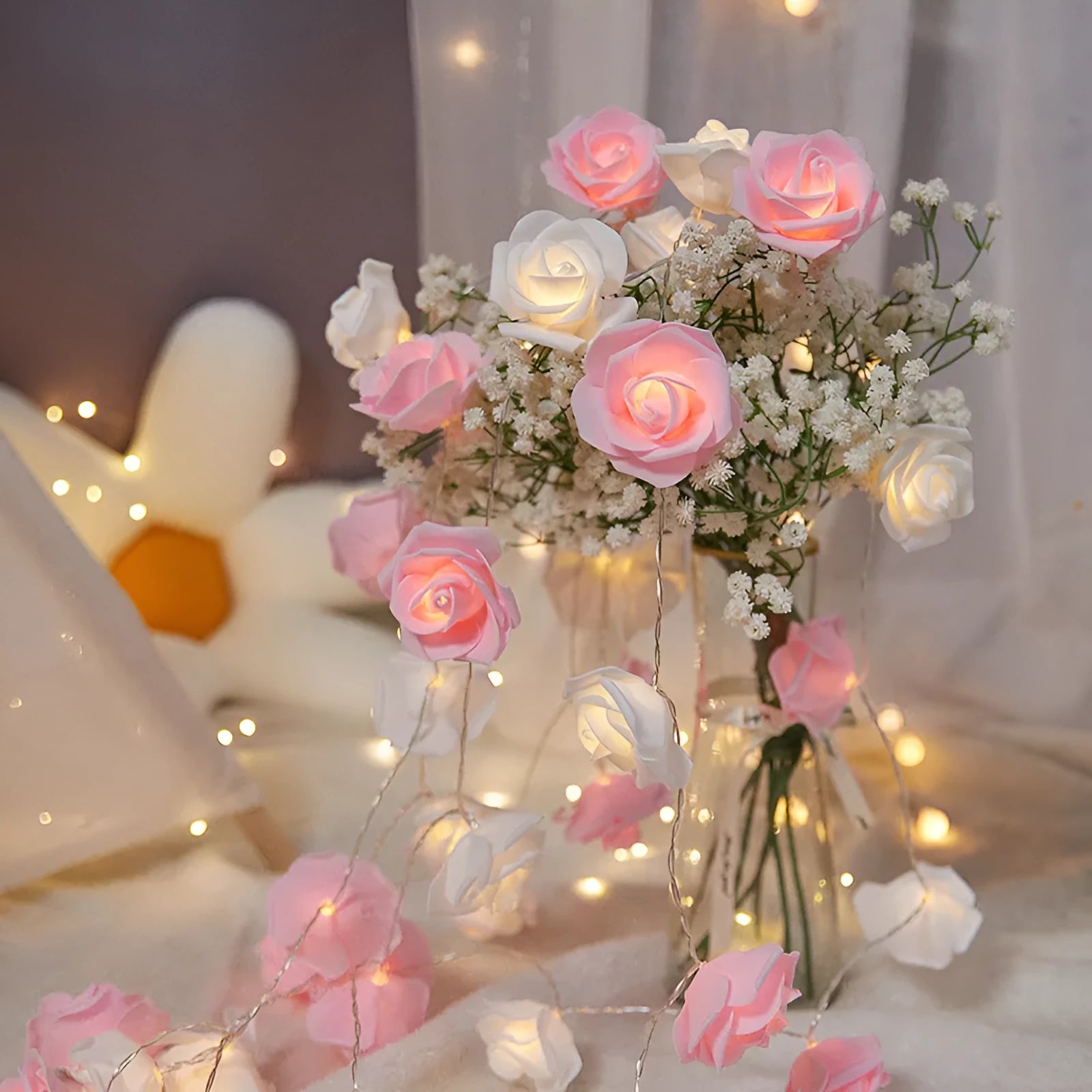 LED rose-shaped fairy light string with PV foam lamps on a 1.5m battery-powered cord for indoor holiday decoration.