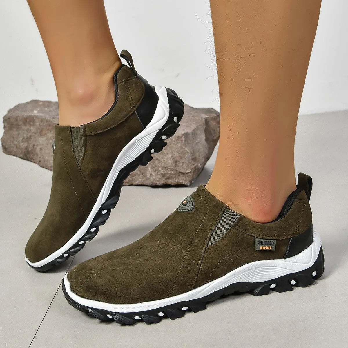 Men's grey round head overshoe cover with rubber sole, shown from the side.