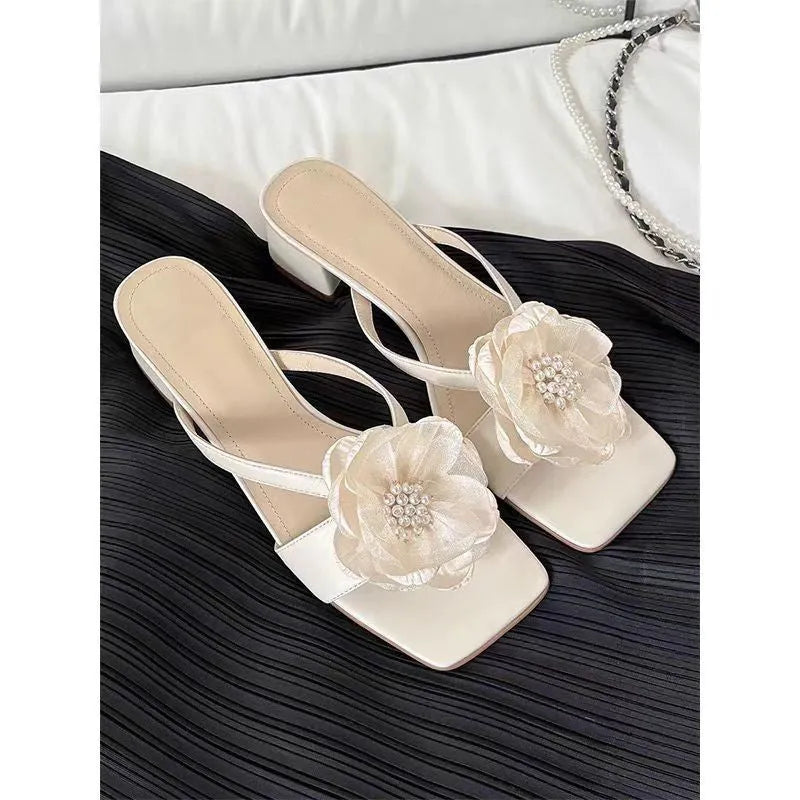 Women's cream chunky heel sandals with a square toe and a single satin strap.