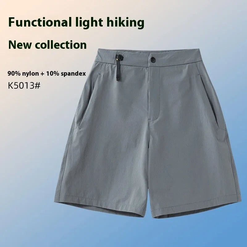 Men's quick-drying sports shorts in a solid colour with elastic waistband and 3D cut leg.