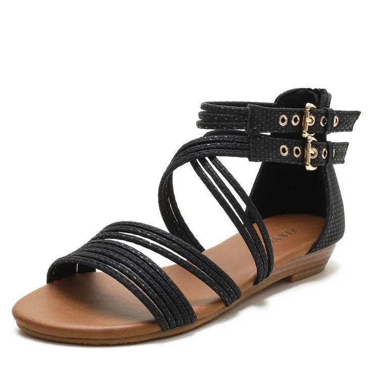 Women's black open toe Roman sandals with cross straps, wedge heel, and back zipper.