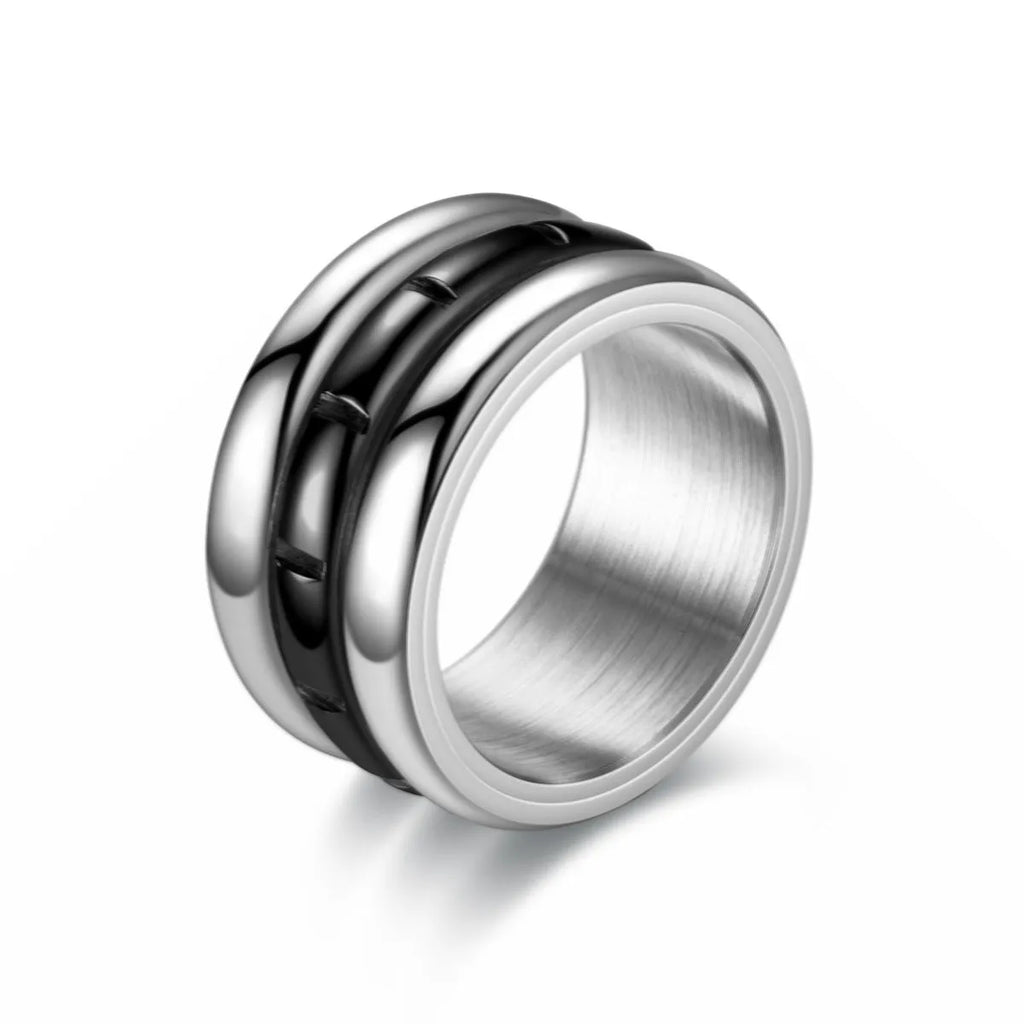 Titanium steel rotating ring with carved geometric band, shown in black or gold, unisex sizes 6 to 13