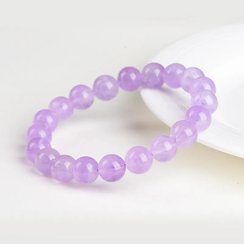 Lavender amethyst crystal bracelet with round beads and water ripple design elements