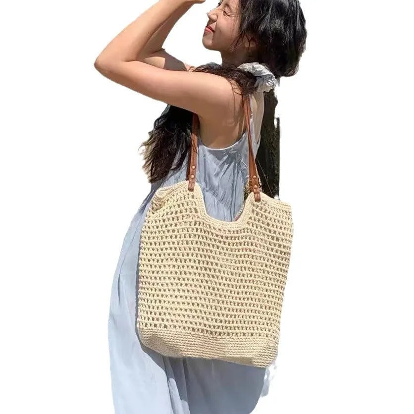 Beige woven cotton and linen large capacity shoulder bag with a choice of magnetic snap or zipper closure.