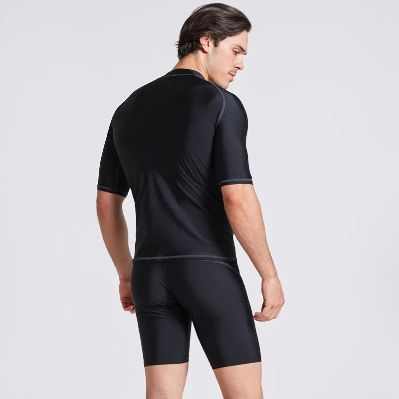 Men's blue half-sleeve quick-dry nylon swimsuit top and pants set for swimming and surfing.