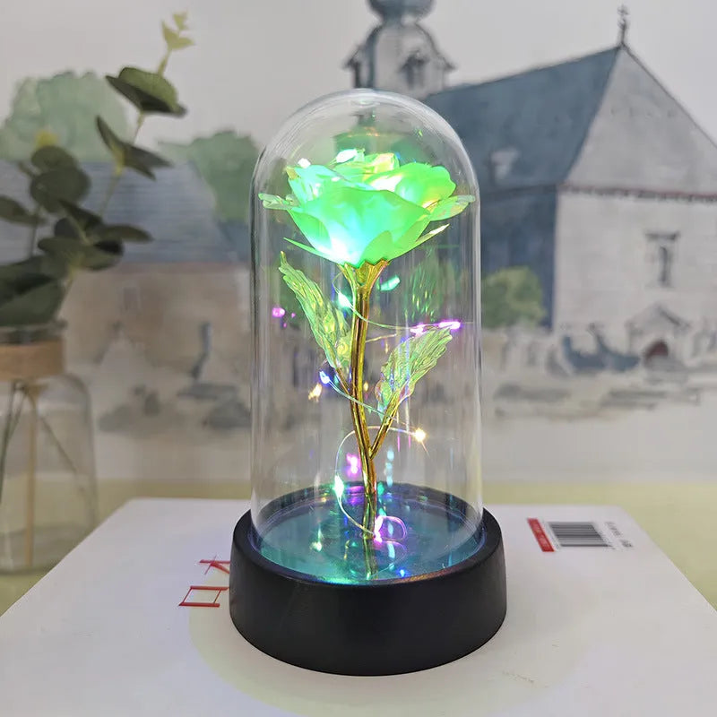 Small decorative night lamp with plastic flower cover and black base, showing coloured light option.