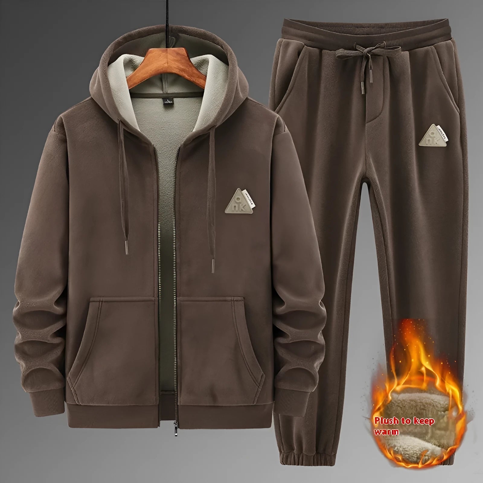 Grey men's casual sports suit with hooded sweater and matching trousers laid flat.