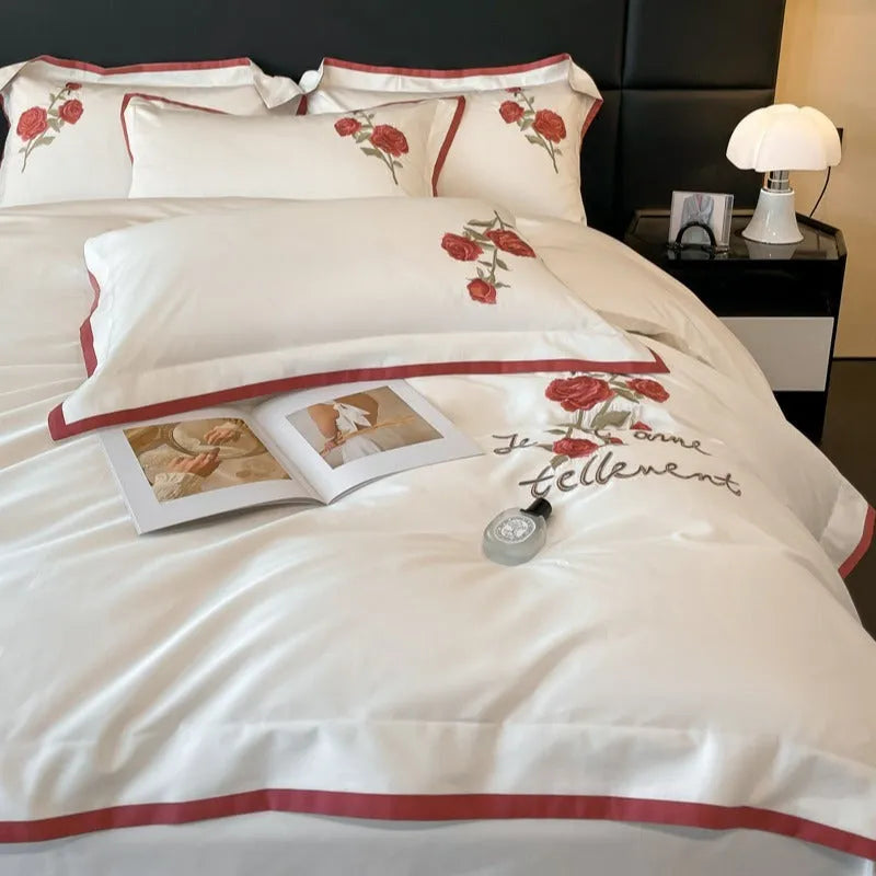 Cotton four-piece bedding set in solid colour with embroidery, includes quilt cover, bed sheet, and pillowcases