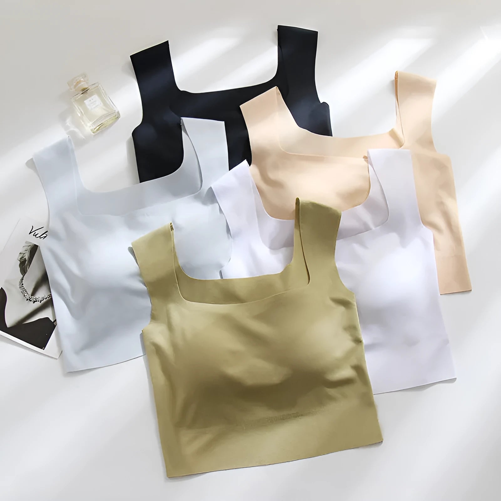 Women's seamless non-marking sling vest in light blue with integrated chest pad for light sports.