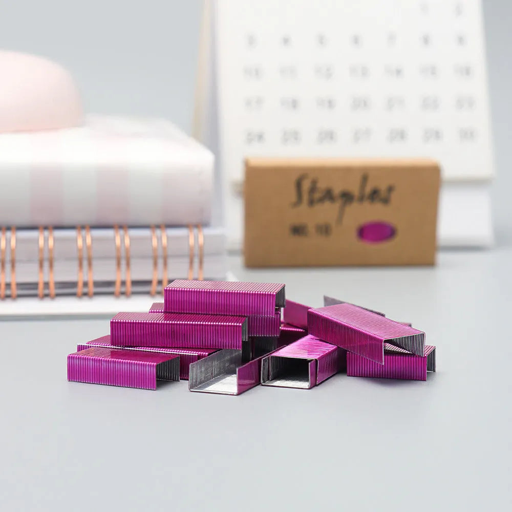 Box of 1000 metal stitching needles and staples in black, purple, rose gold, and rose red colour options.