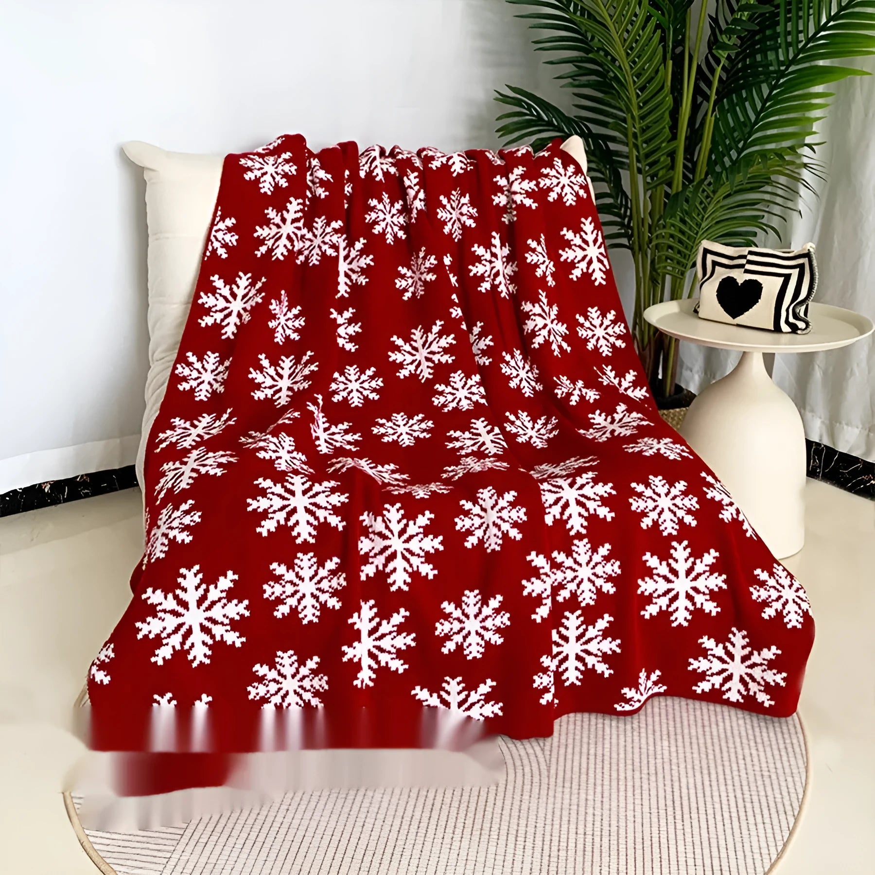 Personalised Christmas acrylic blanket with snowflake design draped over a sofa