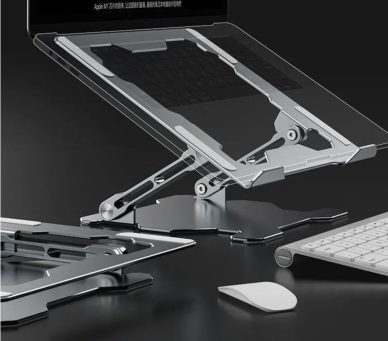 Grey adjustable aluminium laptop stand in open and folded positions on a wooden desk.