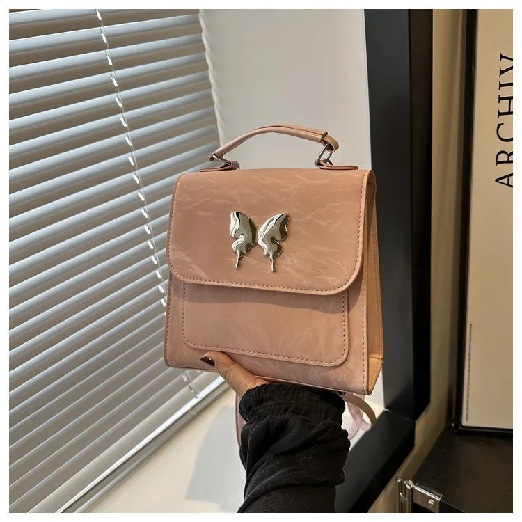 Women's preppy style PU backpack with hand-carry handle showing bow decoration and six colour options