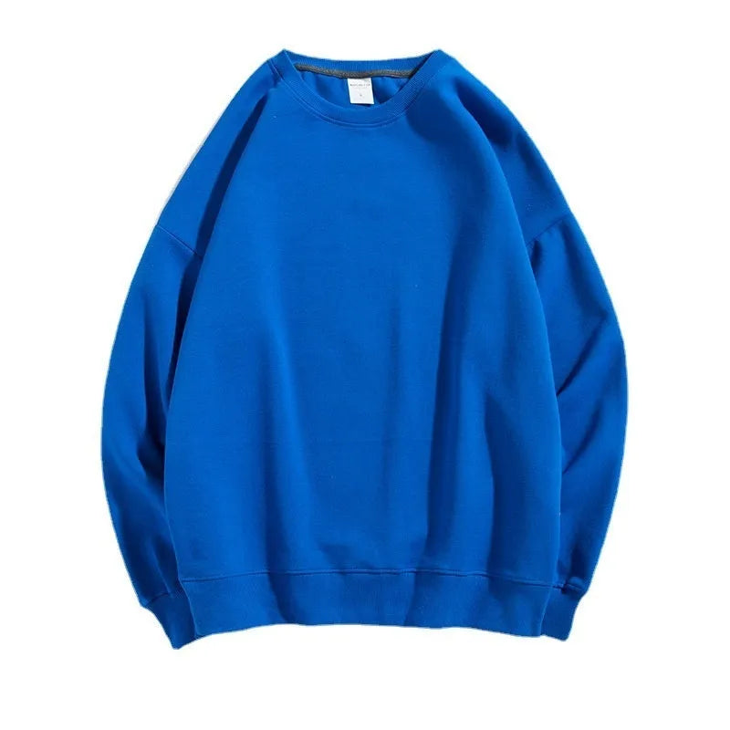 Loose-fitting, cotton, off-shoulder knit sweater in a solid colour on a hanger.