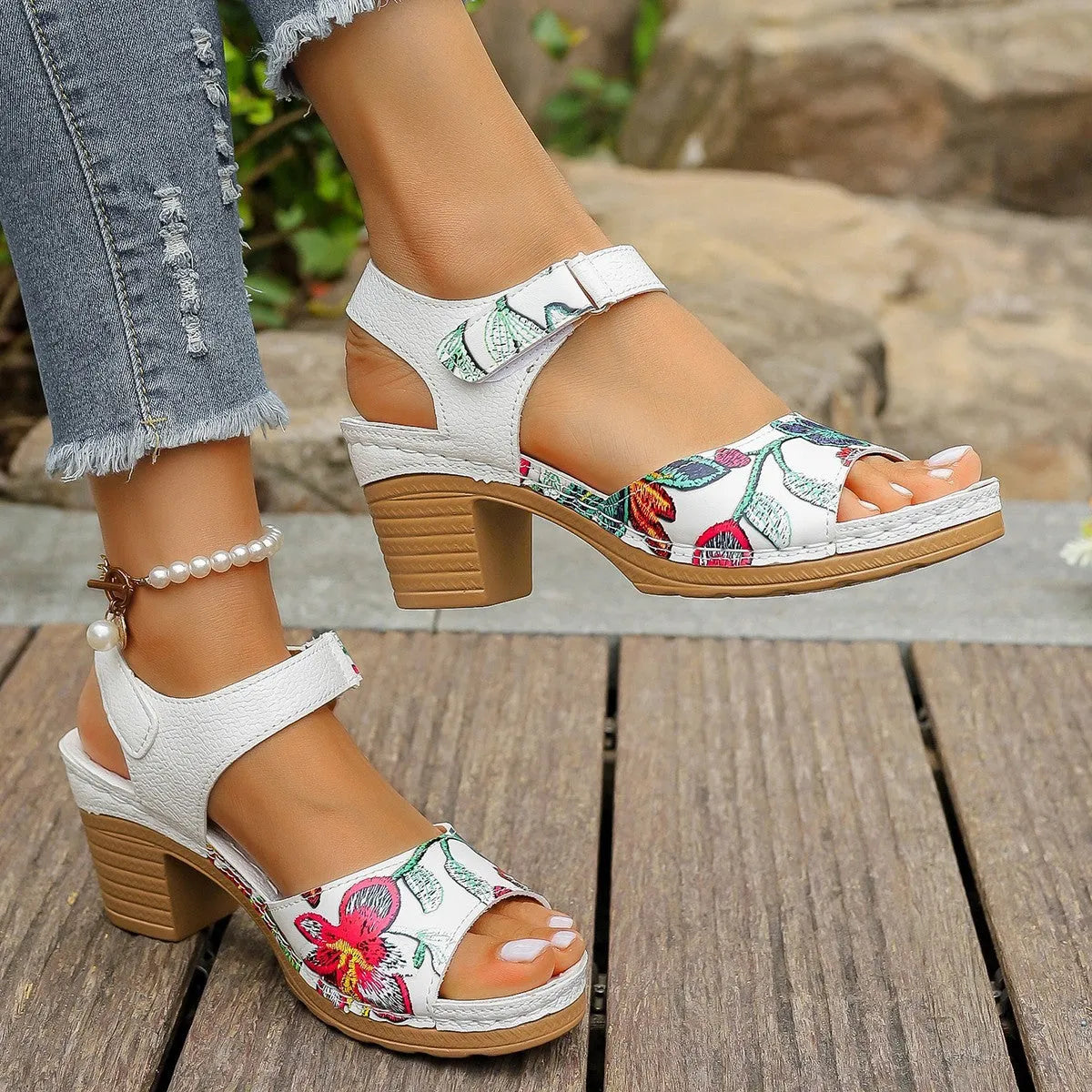 White women's high heel sandals with velcro buckle closure showing PU leather upper and rubber sole