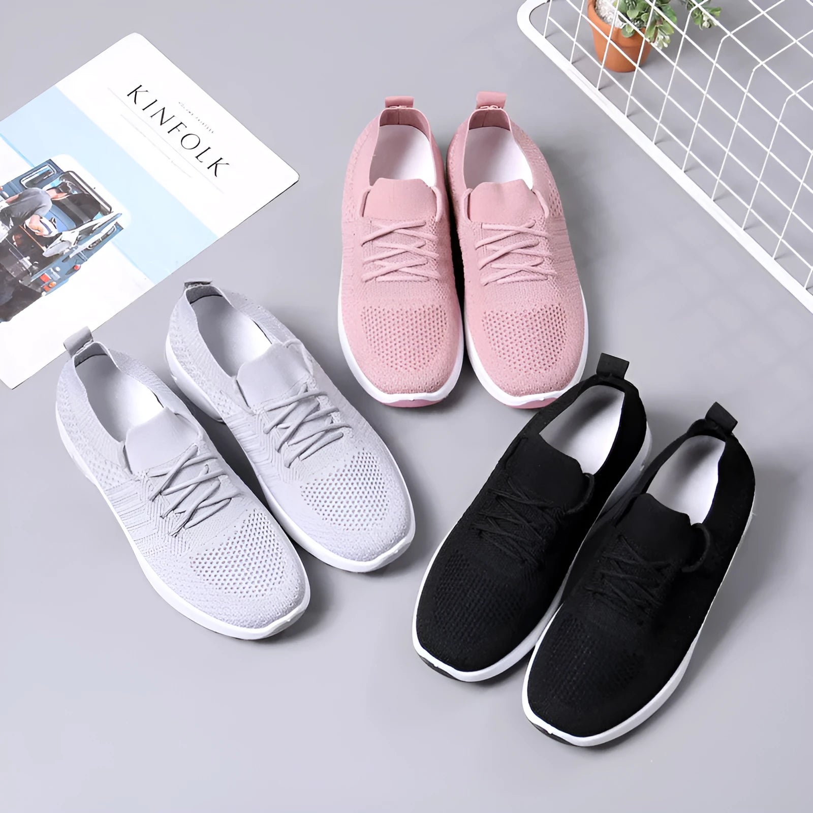 Women's black mesh casual sneakers with lace-up front and round toe on a soft PVC sole.