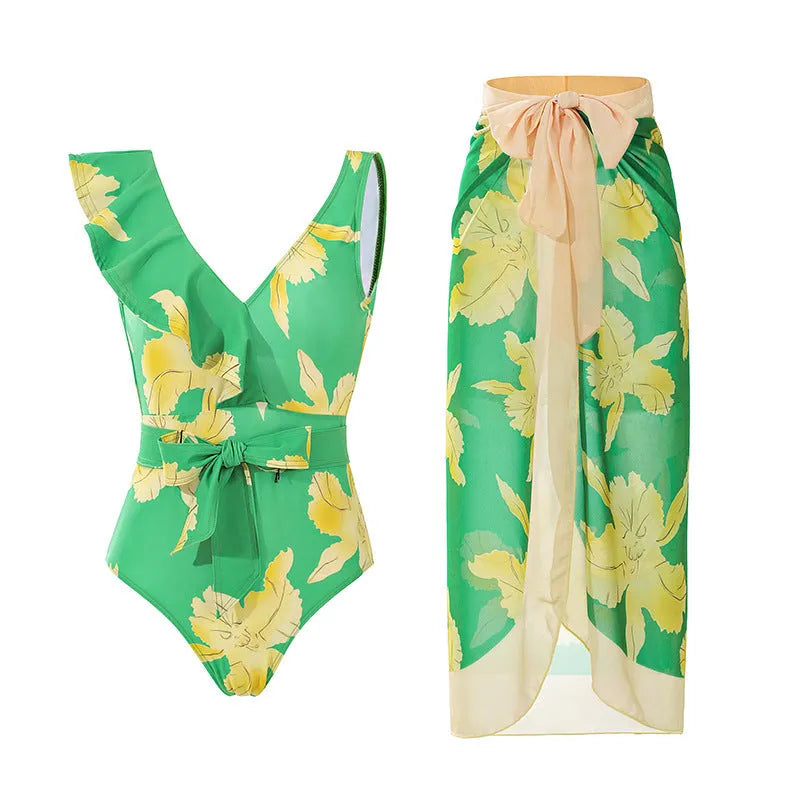 Women's solid colour spaghetti strap one-piece swimsuit with a matching skirt.