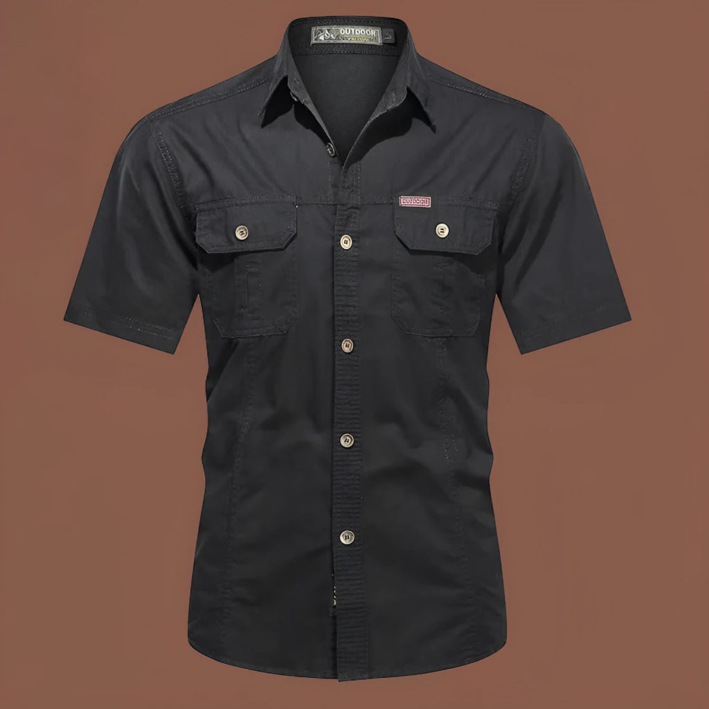 Men's loose fit cotton work shirt in army green with short sleeves and button front.