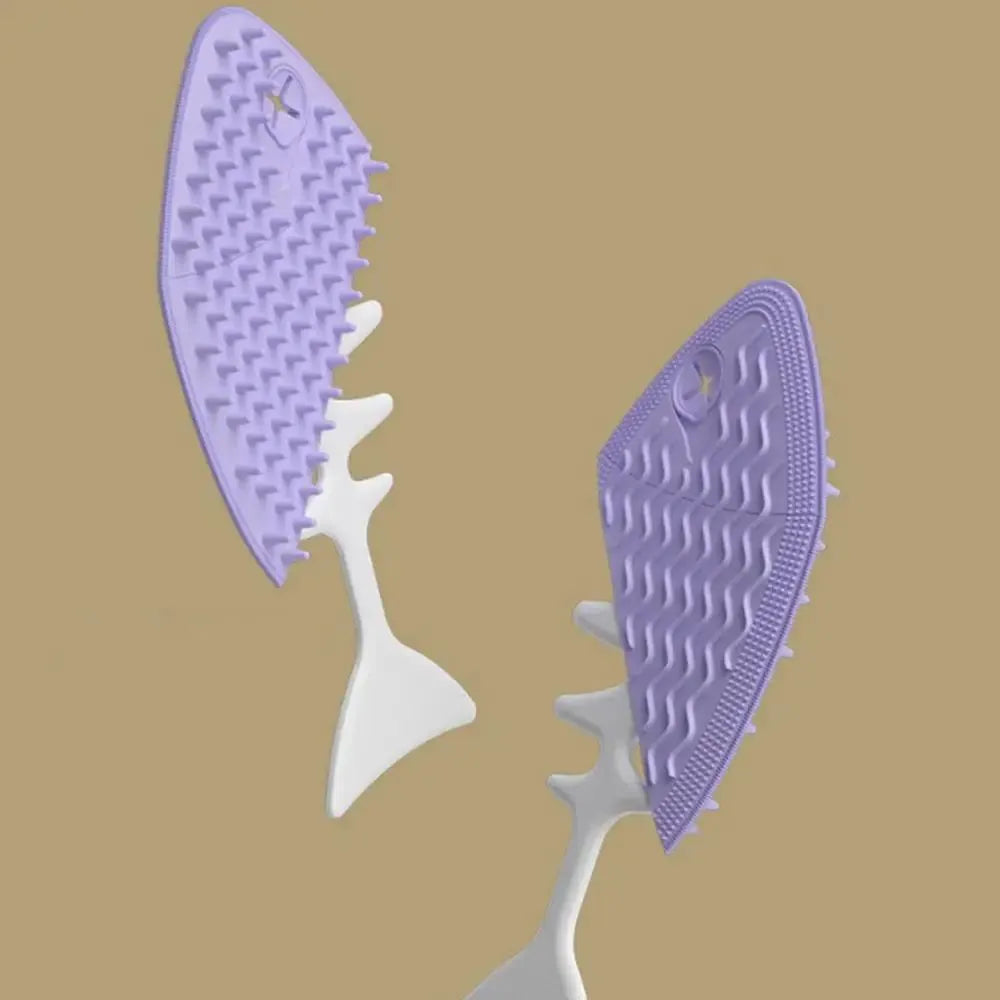 Fishbone-shaped cat brush for indoor pets, available in blue, gray, and purple colours