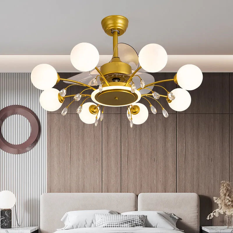 Gold and black ceiling fan lamp with chandelier-style lights and metal blades.