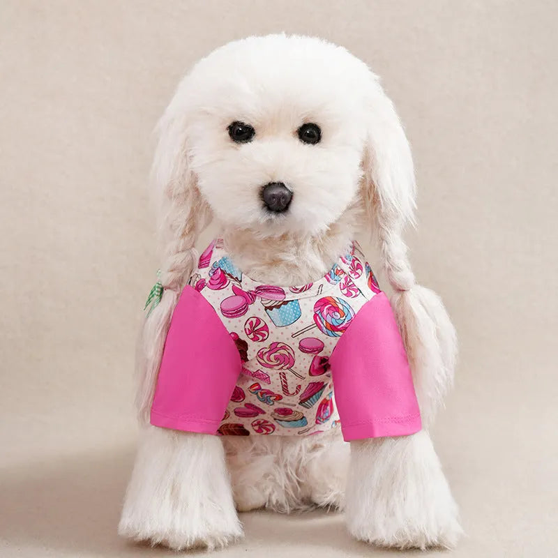 Colourful printed polyester t-shirt for a small dog, showing size chart with chest and length measurements.