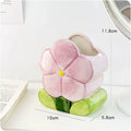 Ceramic floral pen holder storage box with pink tulip design on desktop