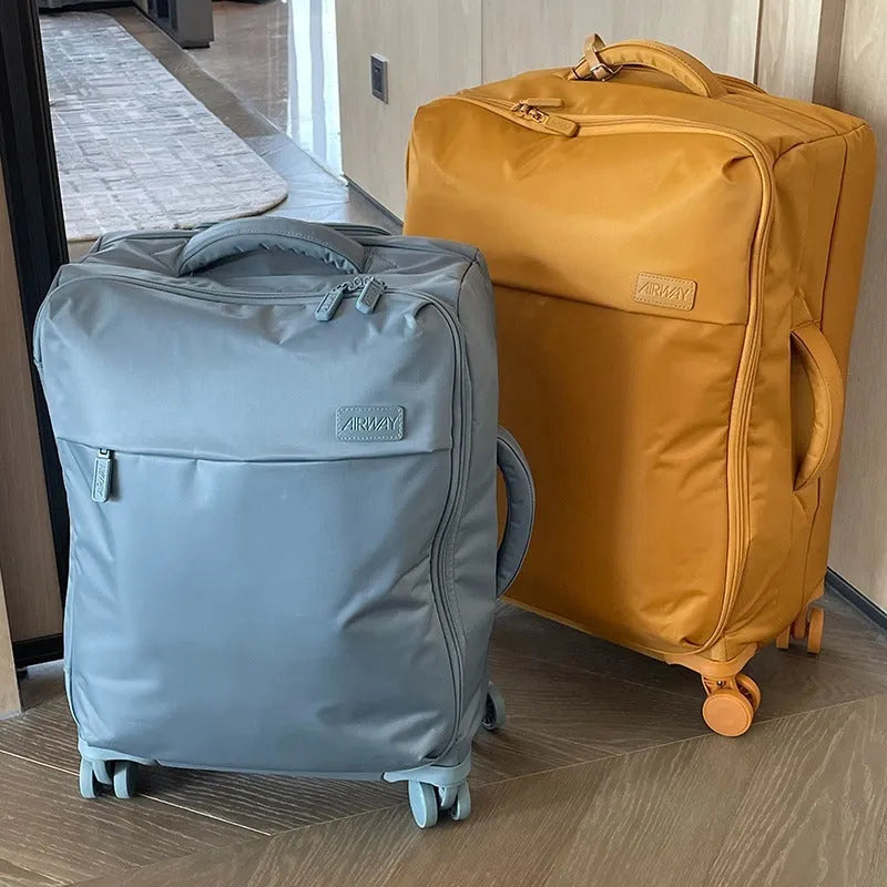 Waterproof Oxford cloth suitcase with universal wheels in bluestone green colour showing three size options
