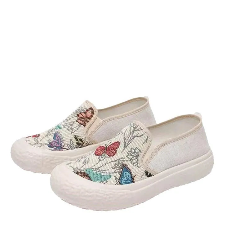 Old Beijing women's slip-on canvas shoes in black or white with a round toe and shallow cut.