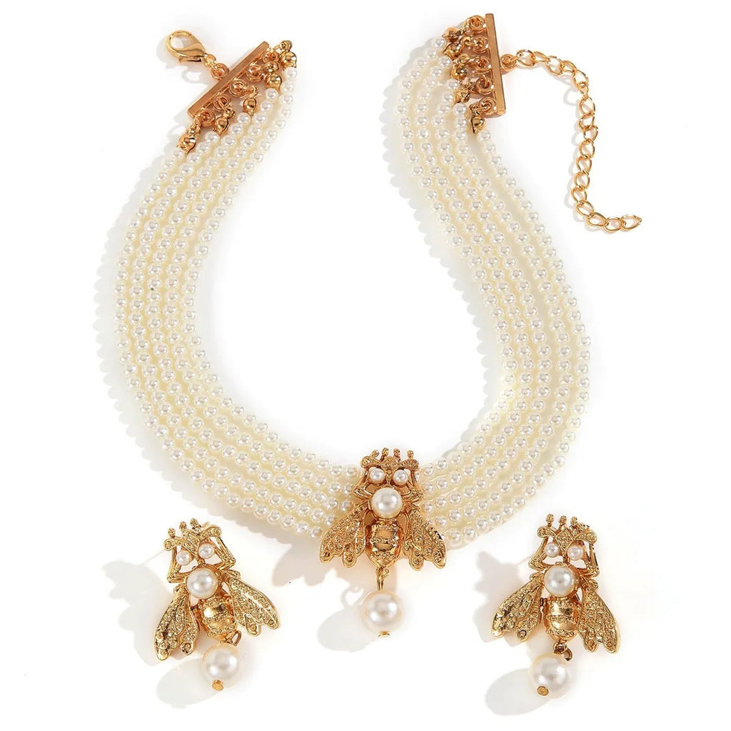 Golden bee earrings and necklace set on display with alloy pendant and regular chain