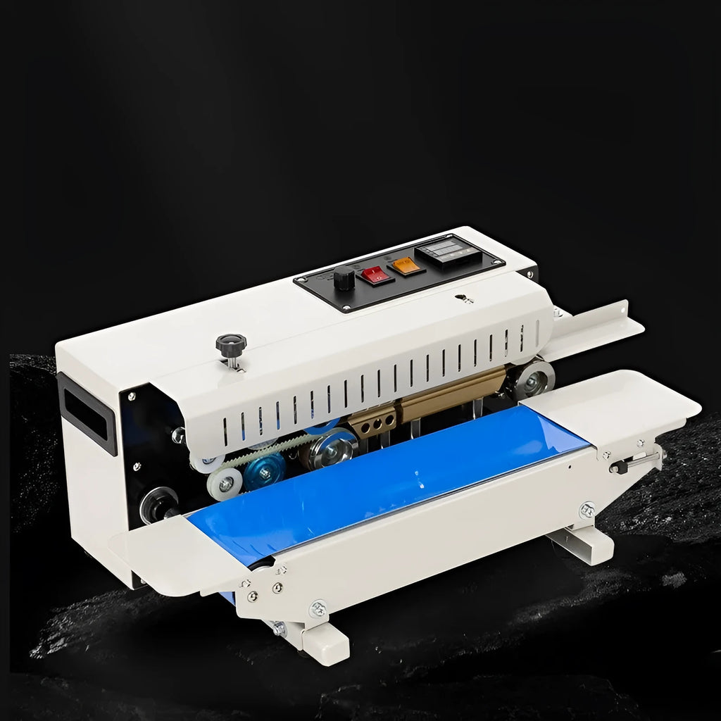 Small steel-frame manual sealing machine for pouches with integrated date printer.
