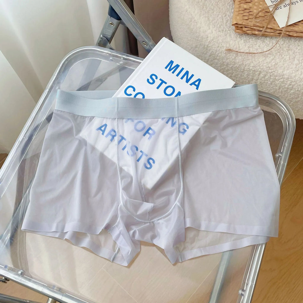 Men's thin nylon boxer shorts in a light brown colour, shown flat to highlight seamless construction.