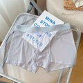Men's thin nylon boxer shorts in a light brown colour, shown flat to highlight seamless construction.
