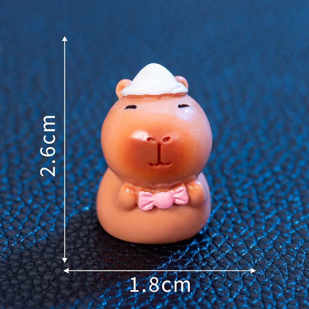 Eight different Halloween-themed capybara resin figurines displayed together