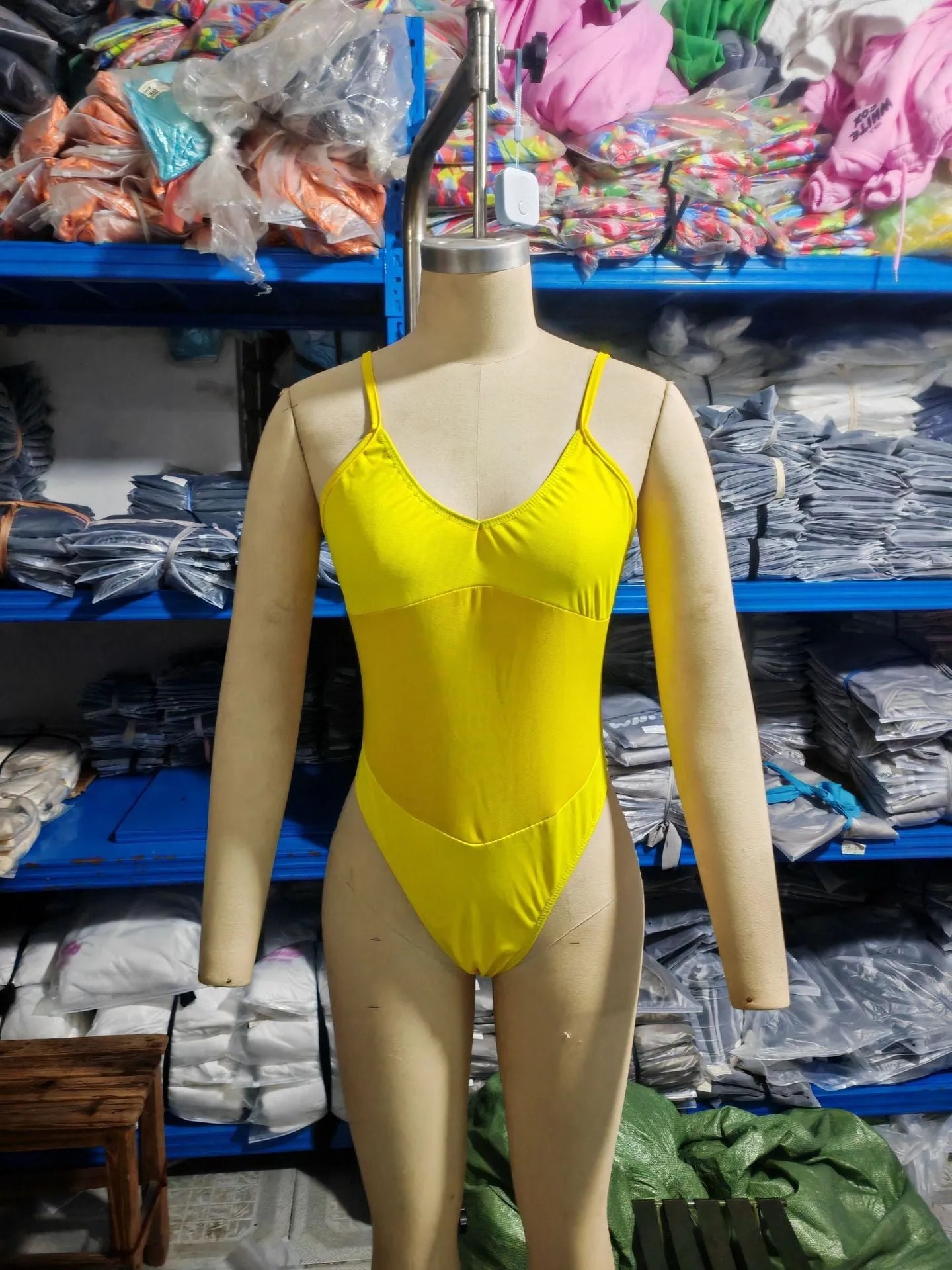 Black women's one-piece swimsuit with banded bikini styling on mannequin