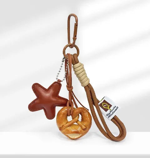 Handmade soda bread style handbag pendant charm with cartoon bread design and brown star accents
