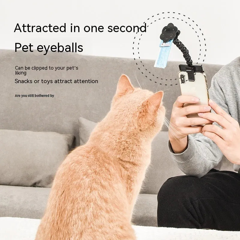 Black pet selfie stick with rotating snack clip attached to mobile phone for animal photography