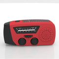 Red rechargeable hand-held radio with emergency torch, USB port, speaker, and wrist strap.
