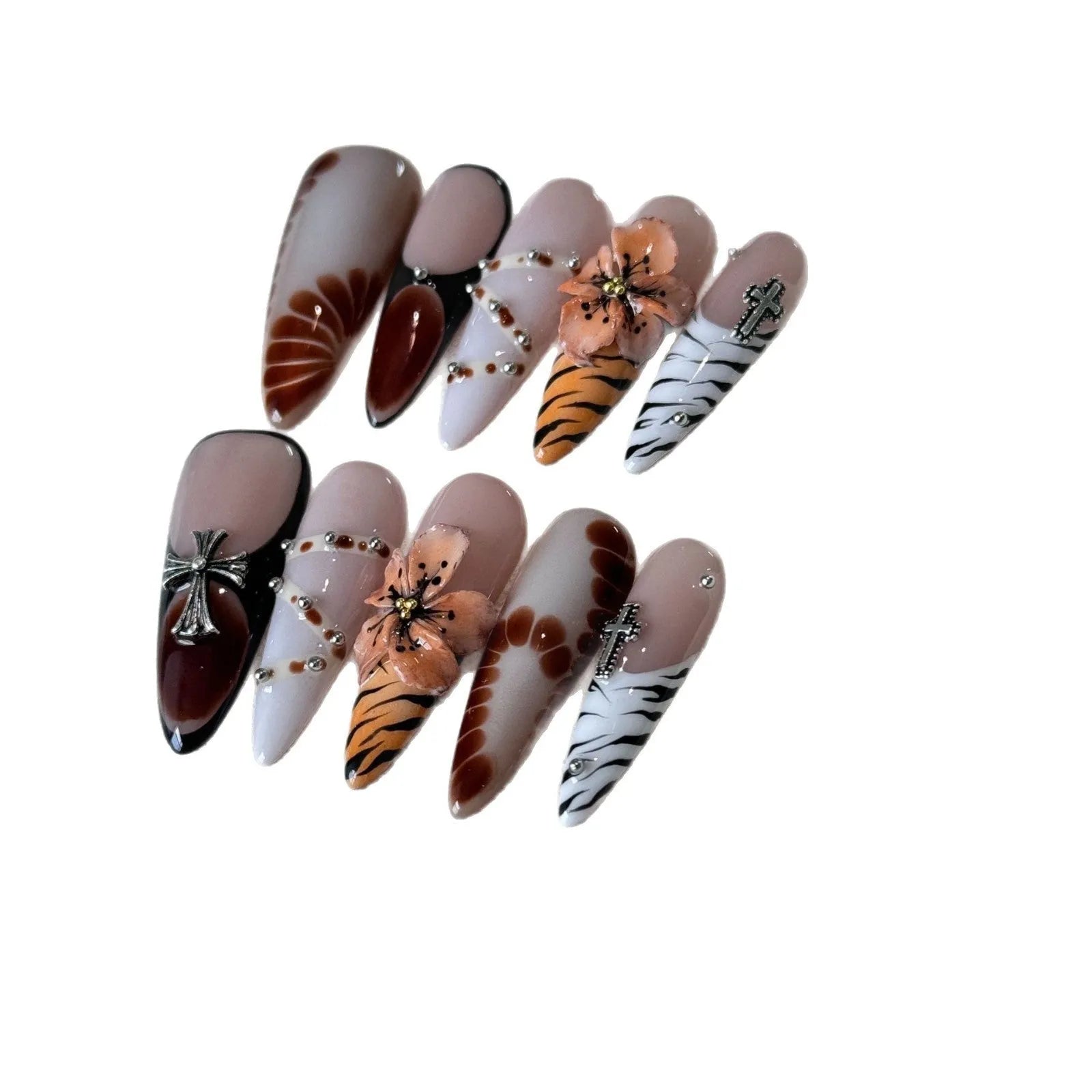 Handmade leopard print false eyelashes with cross and flower details on nail stickers.