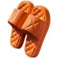 Pair of soft EVA bathroom slippers with a thick non-slip sole, shown in a selection of colours.