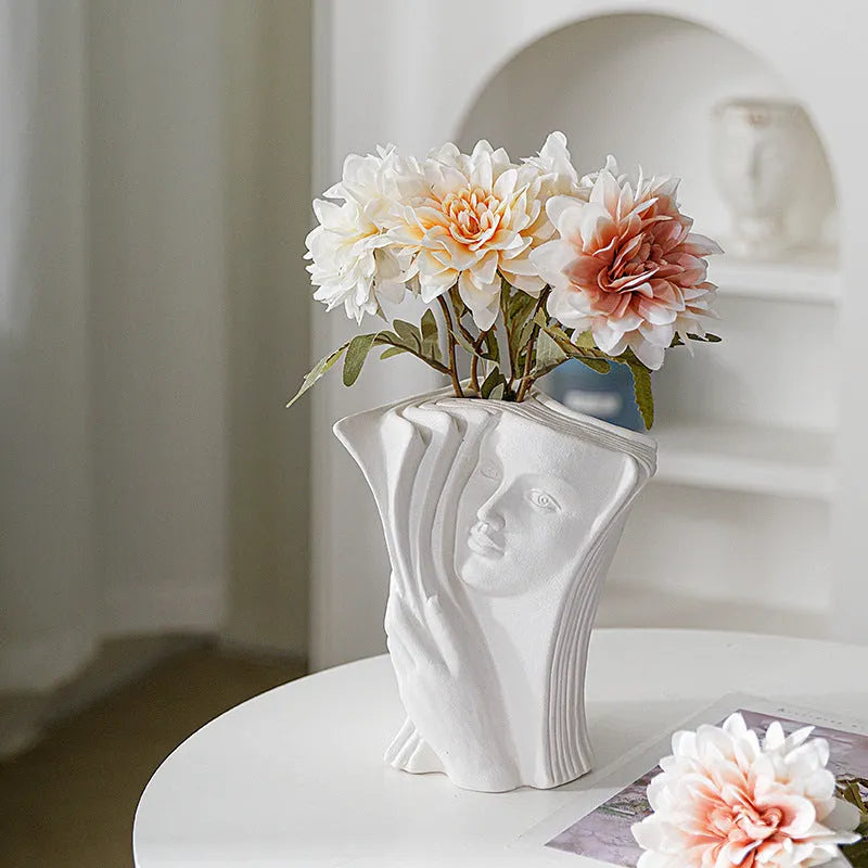 Ceramic book stand in modern design with glazed finish, holding books at an angle