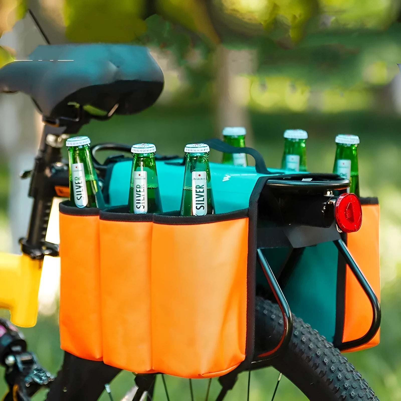 Double-sided black bicycle drink storage bag mounted on bike frame with bottle