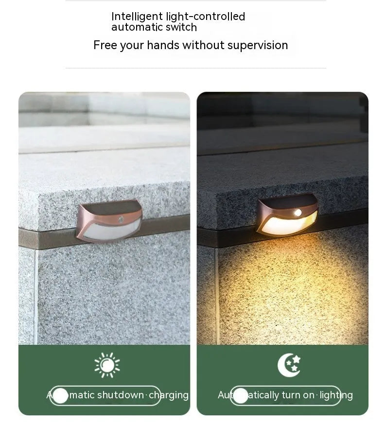 Solar-powered outdoor wall lamp with smiling face design for garden lighting