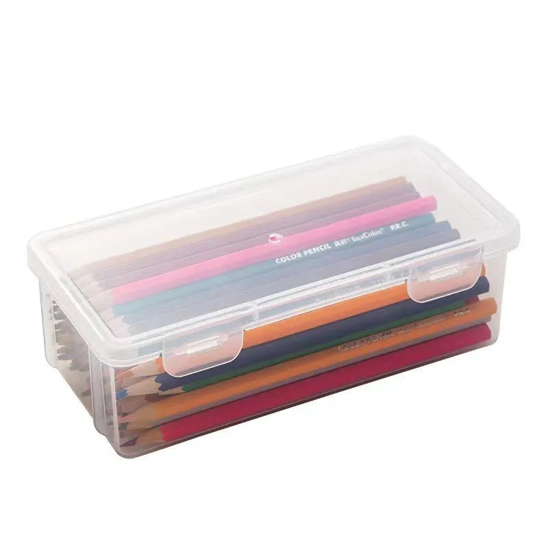 Large transparent plastic stationery storage box filled with coloured pencils and pens