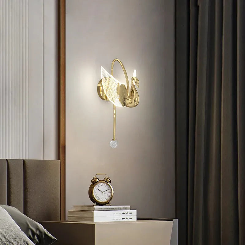 Modern minimalist gold swan wall lamp with acrylic shade showing tricolour LED light options for bedroom bedside use