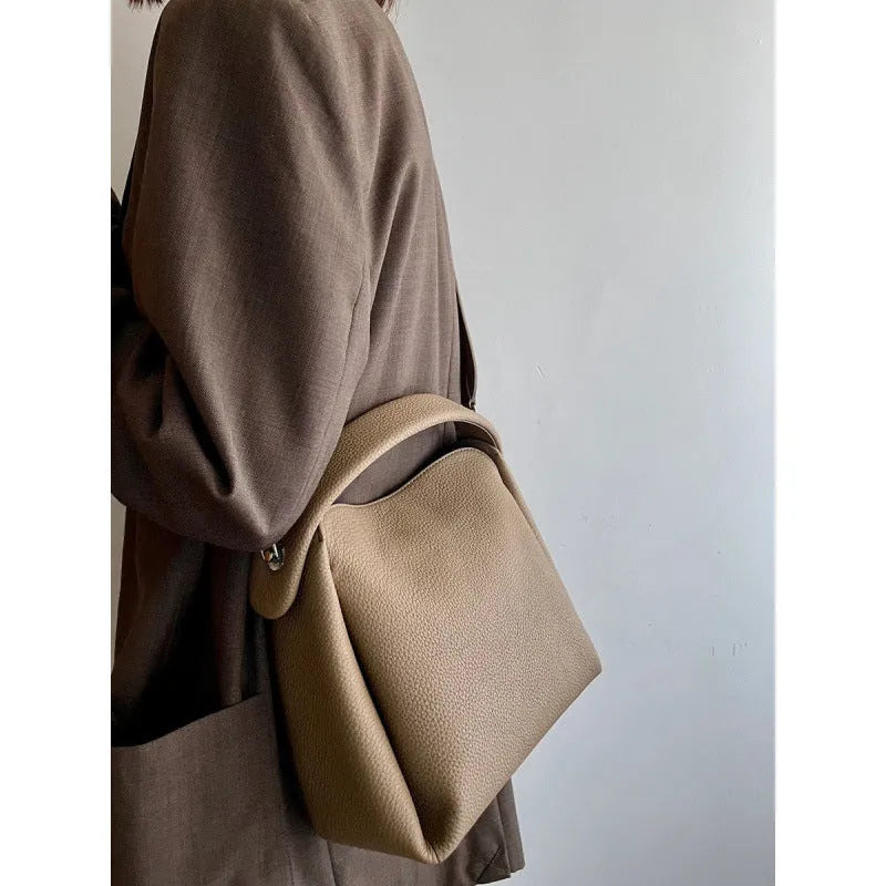Grey women's corduroy shoulder messenger bag with adjustable strap, 24x10x17 cm, on a plain background.