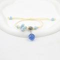 Glass dried flower bracelet with hand-woven beads containing real preserved flowers in various colours
