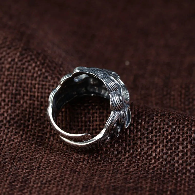 Silver open style ring showing Domineering Jibeast pattern with zodiac animal modelling
